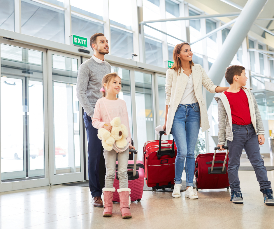 a group of people with luggage in an airport
